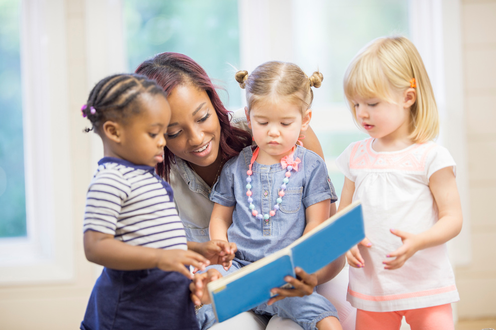 Reading a Story Book to Toddlers