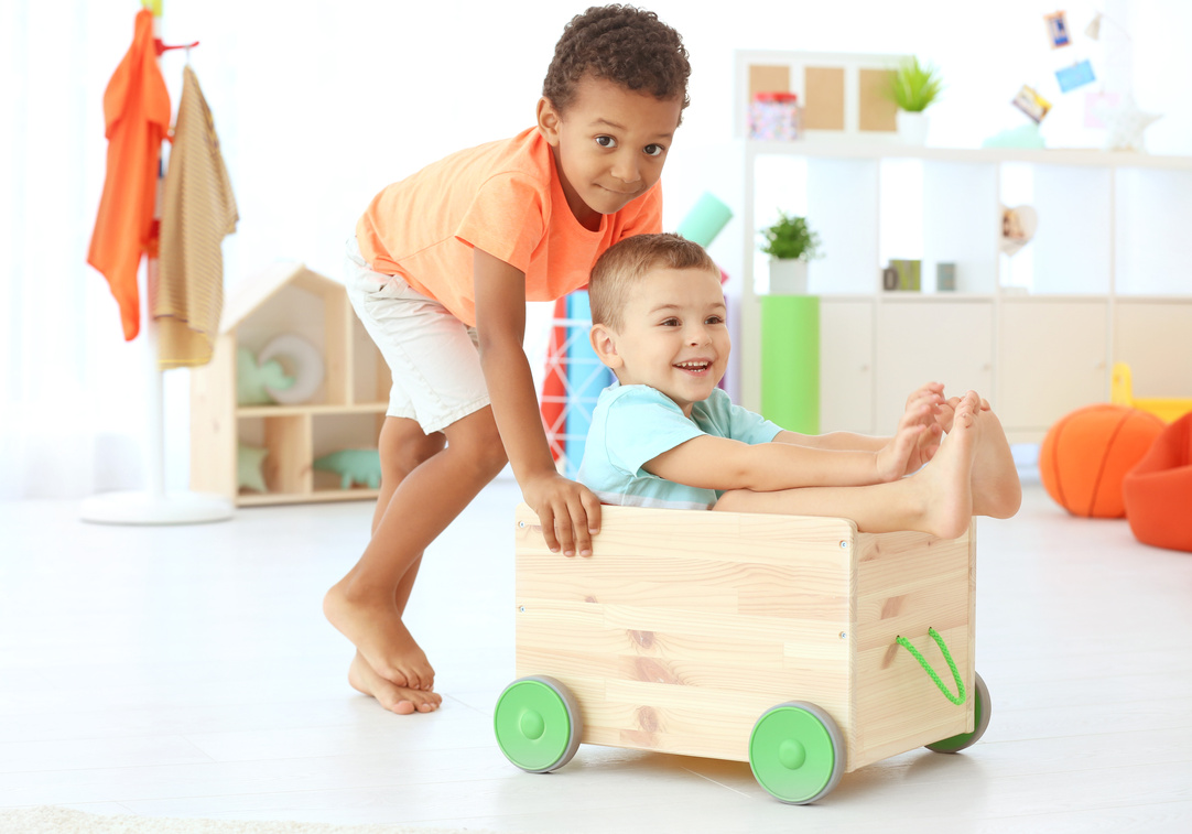 Two Children Playing Indoors